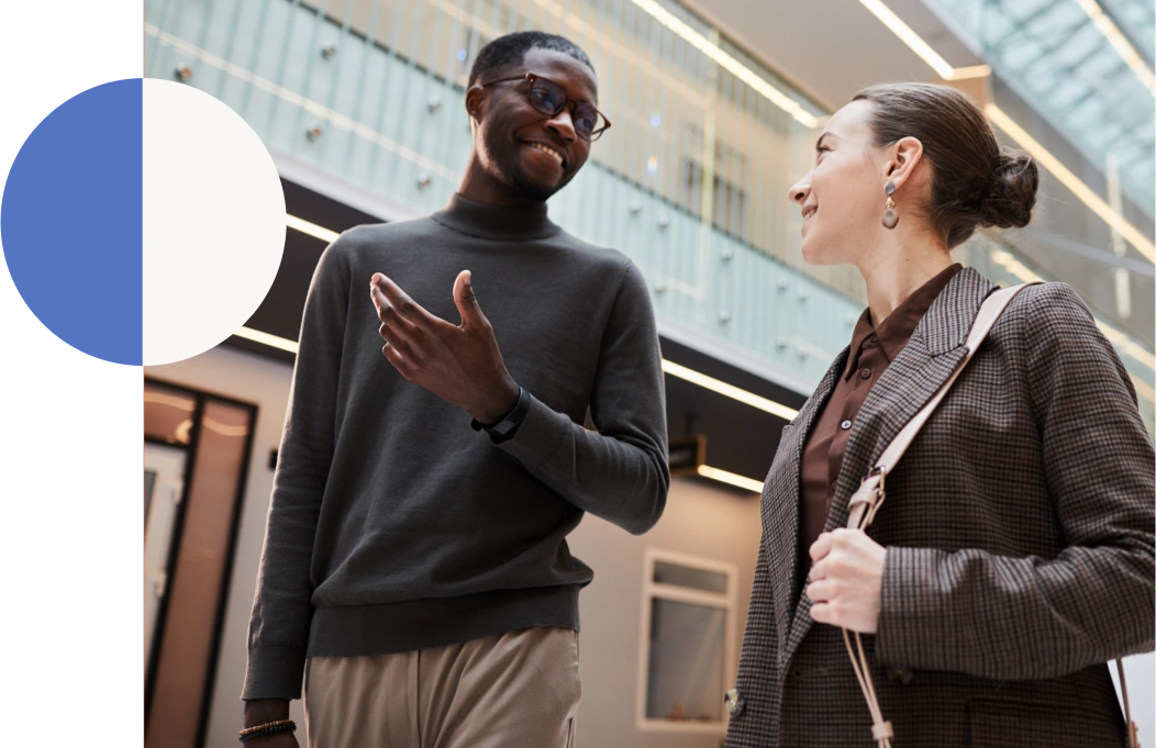 Man and woman talking in an office setting